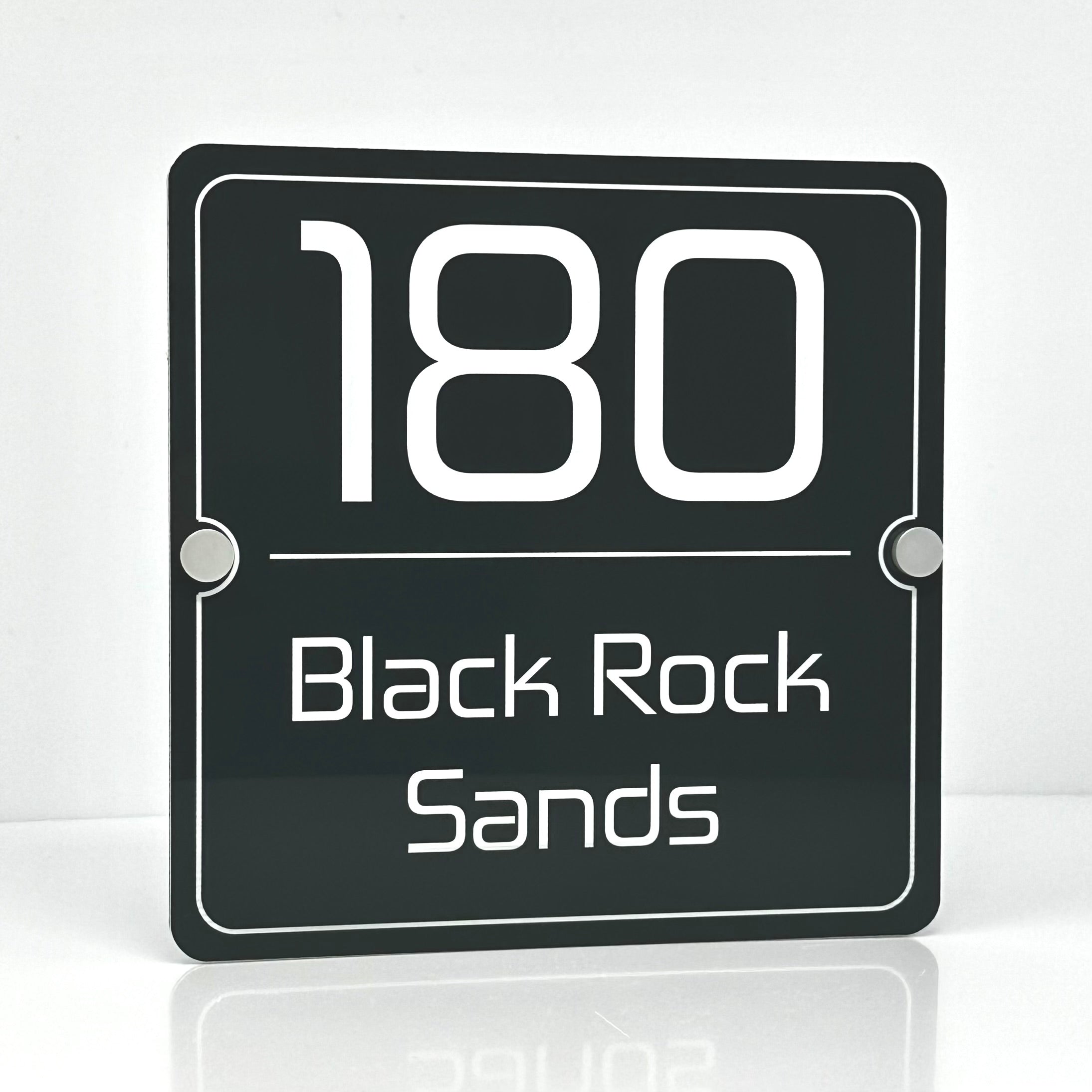 The Black Rock Sands Modern House Sign with a Anthracite Grey Panel and Satin Silver Stand Off Fixings ( Size - 20cm x 20cm )