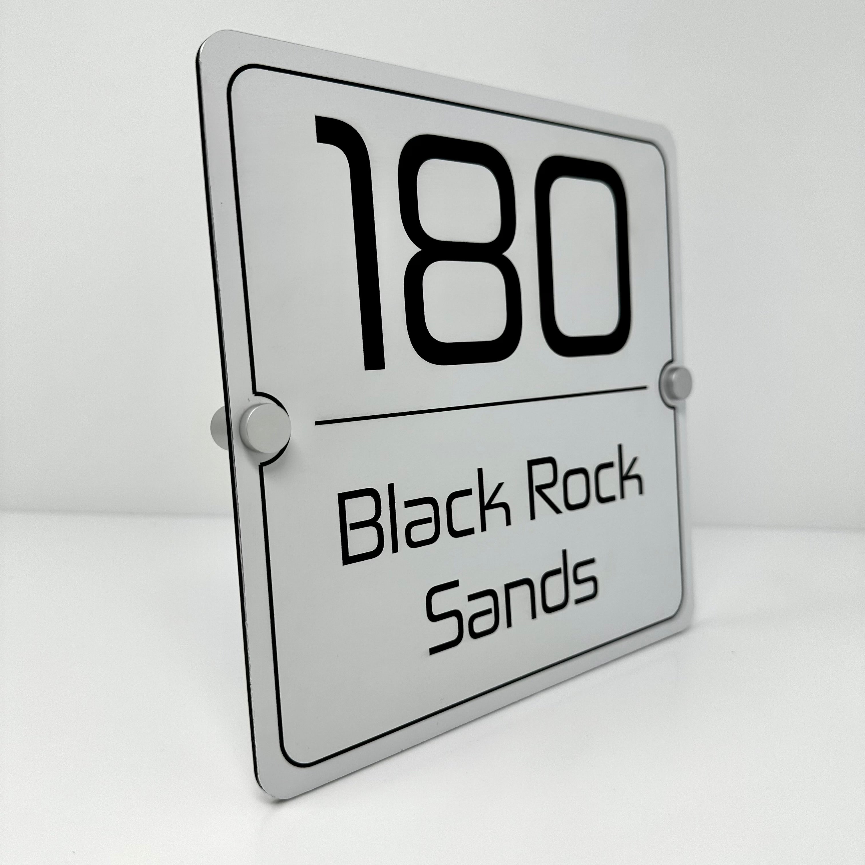 The Black Rock Sands Modern House Sign with a White Panel and Satin Silver Stand Off Fixings ( Size - 20cm x 20cm )