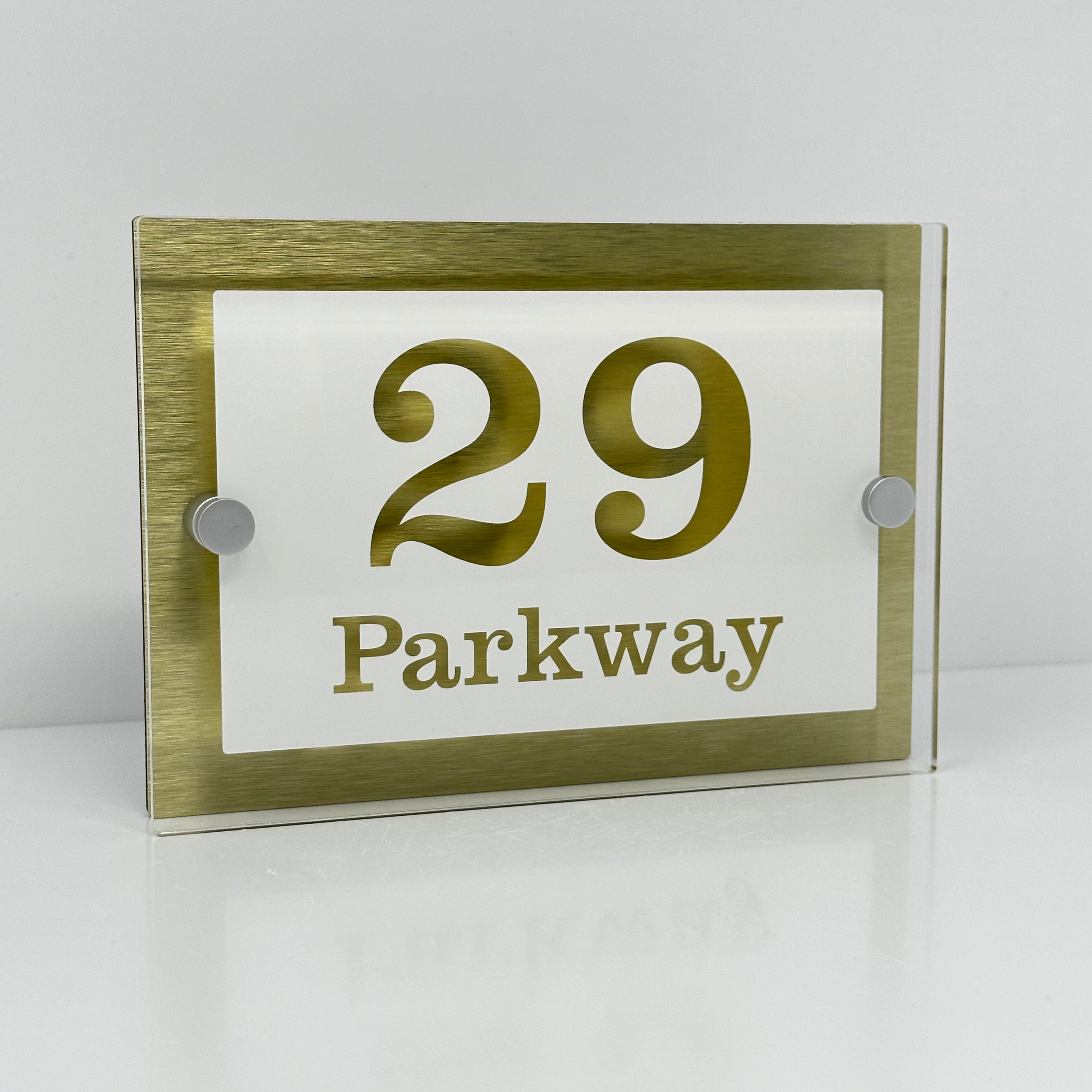 The Parkway Modern House Sign with Perspex Acrylic Front, Gold Rear Panel and Satin Silver Stand Off Fixings ( Size - 20cm x 14cm - WHITE BACKGROUND CLEAR TEXT )