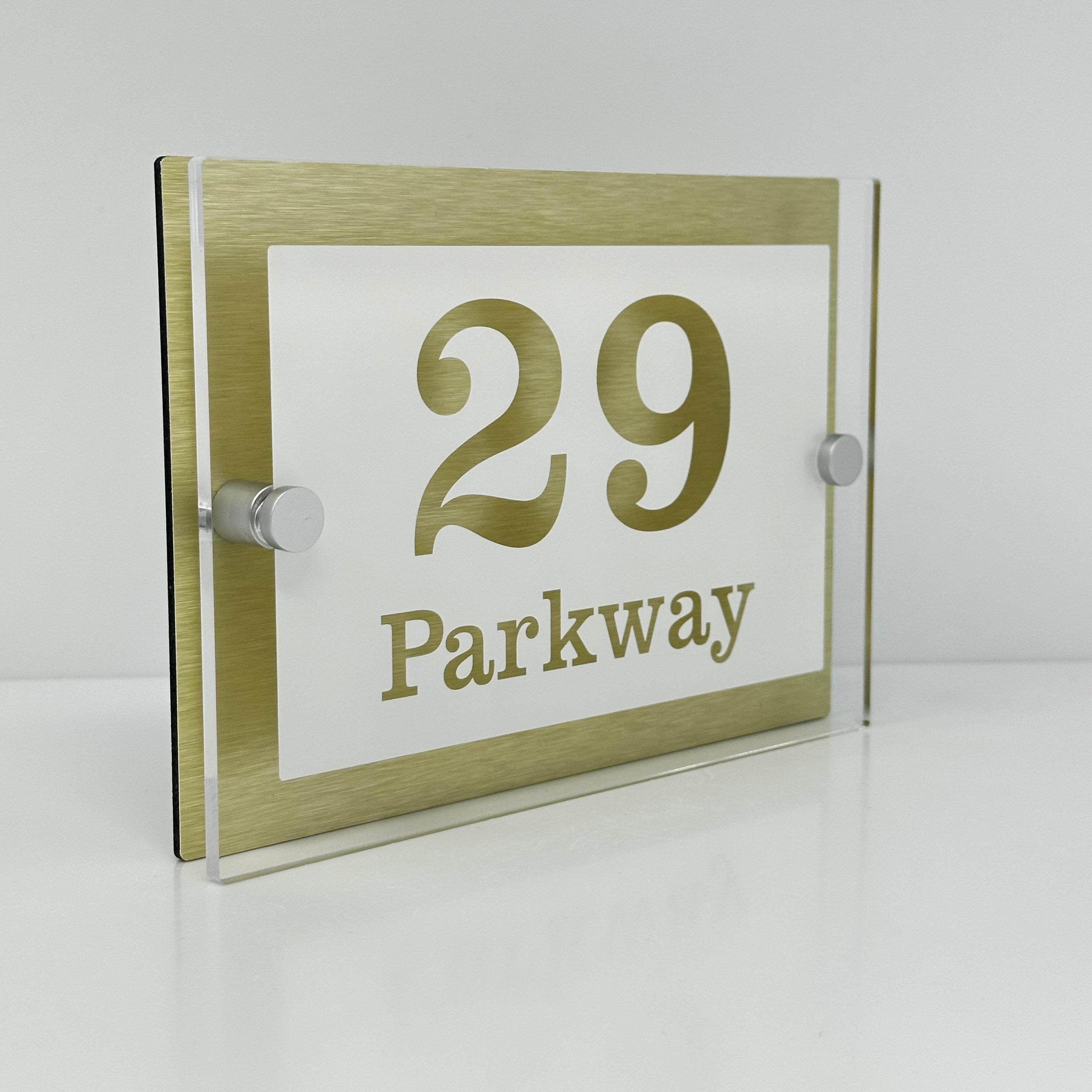 The Parkway Modern House Sign with Perspex Acrylic Front, Gold Rear Panel and Satin Silver Stand Off Fixings ( Size - 20cm x 14cm - WHITE BACKGROUND CLEAR TEXT )