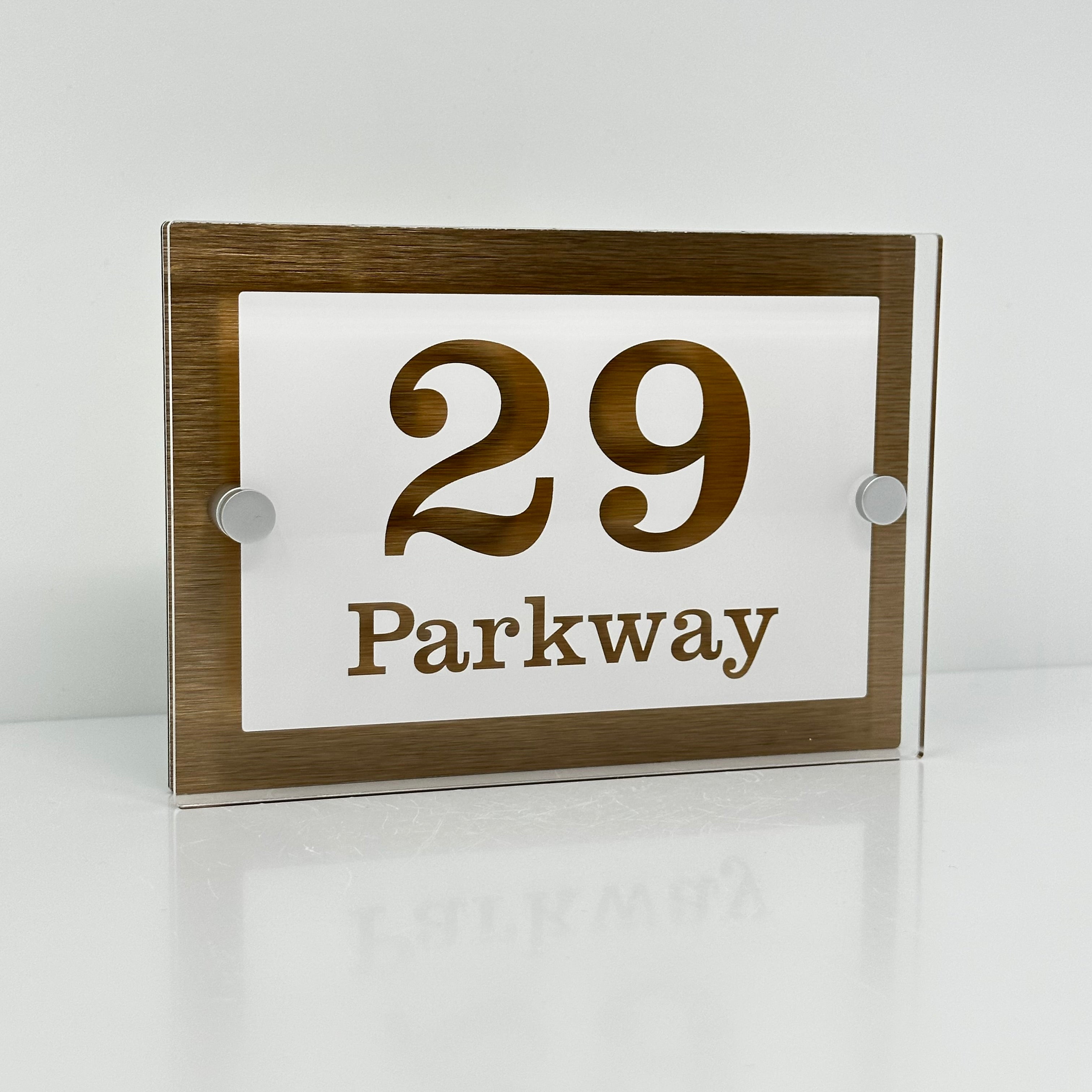 The Parkway Modern House Sign with Perspex Acrylic Front, Brass Rear Panel and Satin Silver Stand Off Fixings ( Size - 20cm x 14cm - WHITE BACKGROUND CLEAR TEXT )