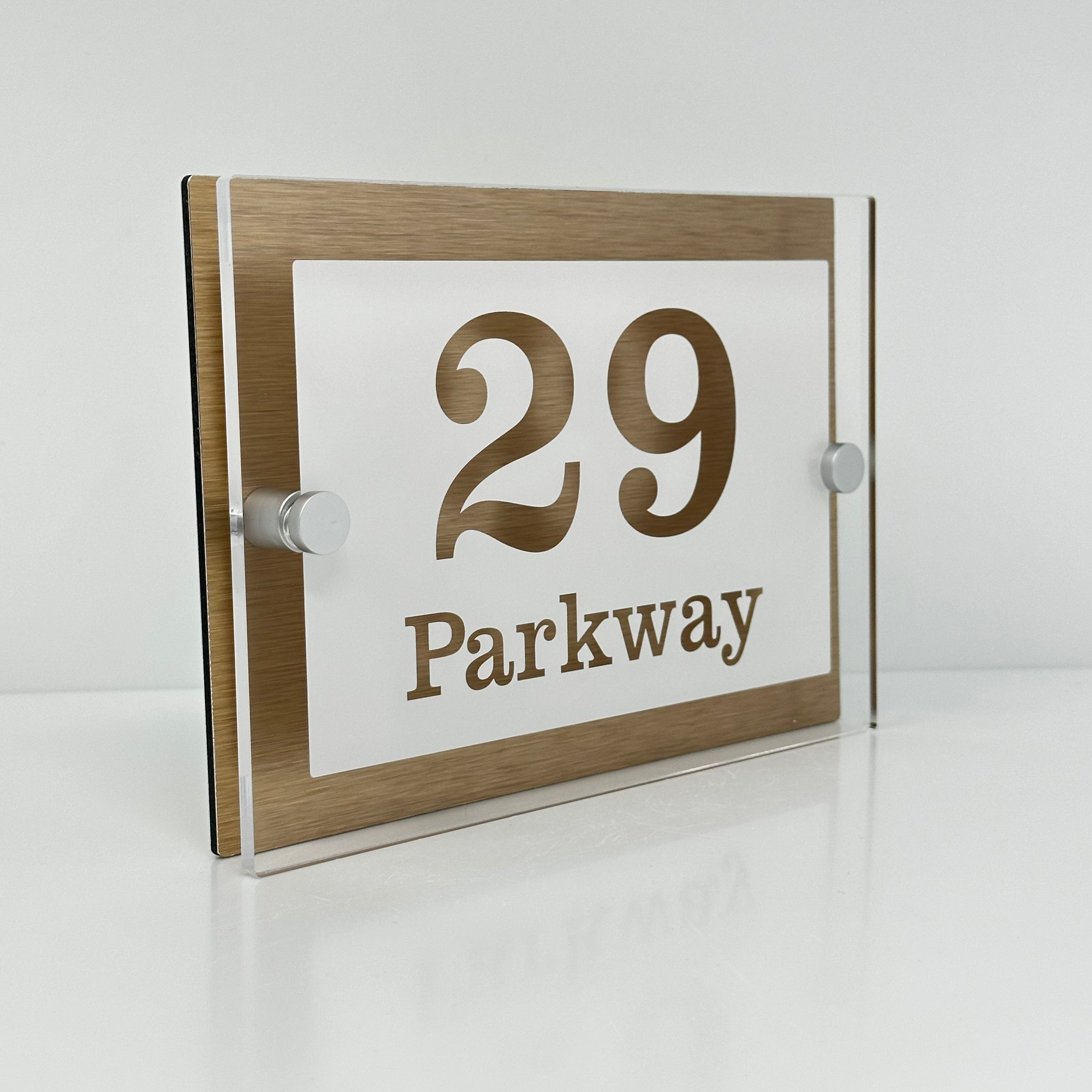 The Parkway Modern House Sign with Perspex Acrylic Front, Brass Rear Panel and Satin Silver Stand Off Fixings ( Size - 20cm x 14cm - WHITE BACKGROUND CLEAR TEXT )