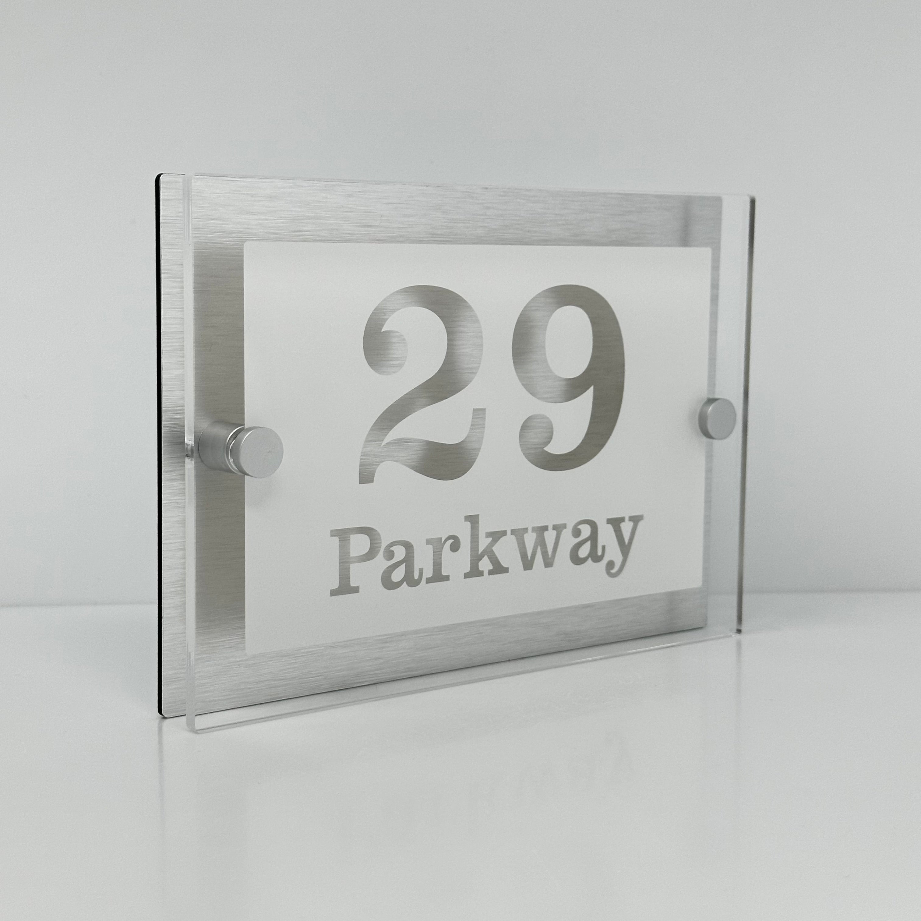 The Parkway Modern House Sign with Perspex Acrylic Front, Silver Rear Panel and Satin Silver Stand Off Fixings ( Size - 20cm x 14cm - WHITE BACKGROUND CLEAR TEXT )