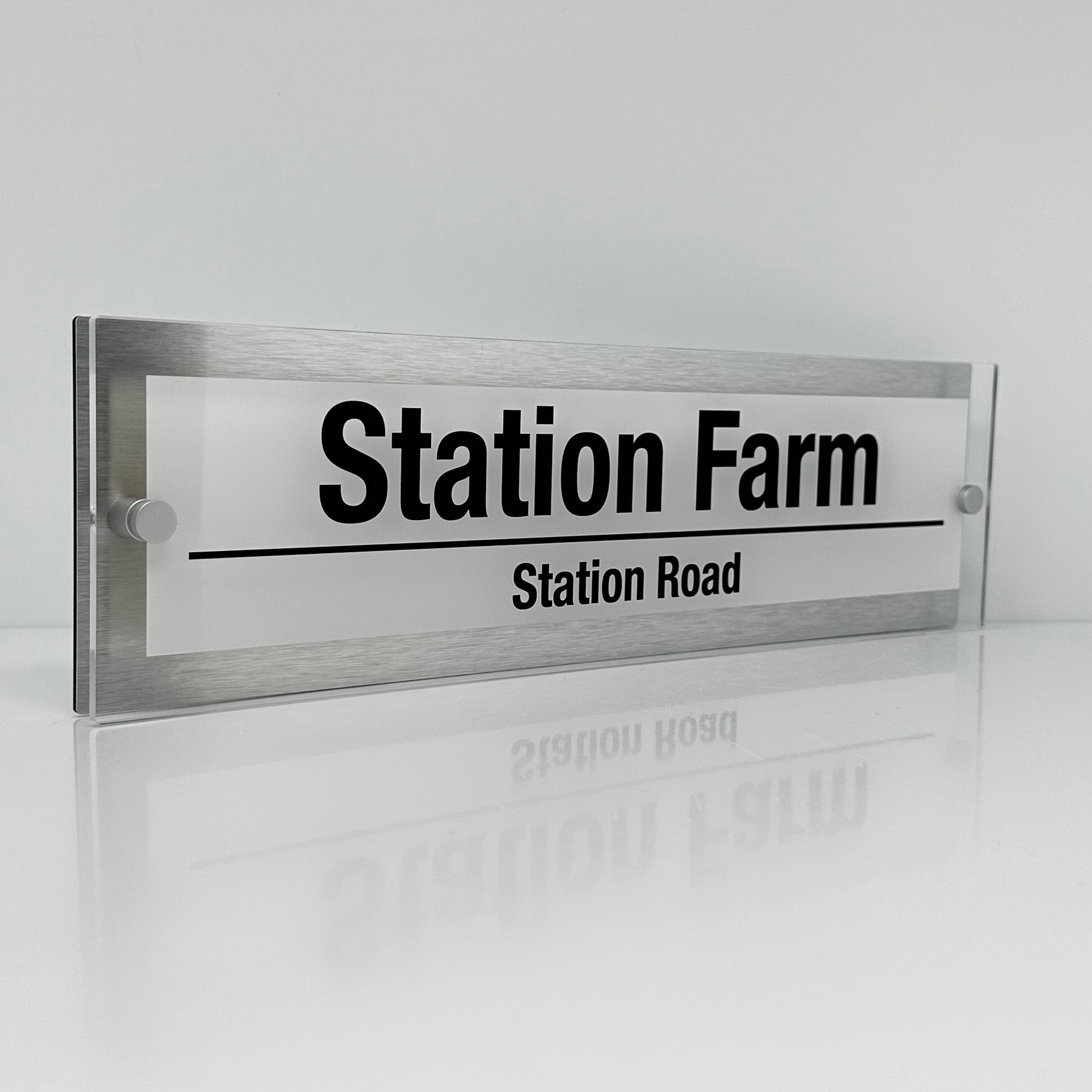 The Station Farm Modern House Sign with Perspex Acrylic Front, Silver Rear Panel and Satin Silver Stand Off Fixings ( Size - 42cm x 12cm - WHITE BACKGROUND BLACK TEXT )
