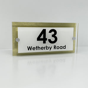 The Wetherby Modern House Sign with Perspex Acrylic Front, Gold Rear Panel and Satin Silver Stand Off Fixings ( Size - 25cm x 12cm - WHITE BACKGROUND BLACK TEXT )