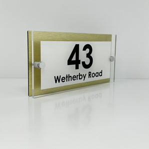 The Wetherby Modern House Sign with Perspex Acrylic Front, Gold Rear Panel and Satin Silver Stand Off Fixings ( Size - 25cm x 12cm - WHITE BACKGROUND BLACK TEXT )