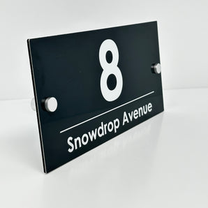 The Snowdrop Modern House Sign with a Anthracite Grey Panel and Satin Silver Stand Off Fixings ( Size - 25cm x 12cm )