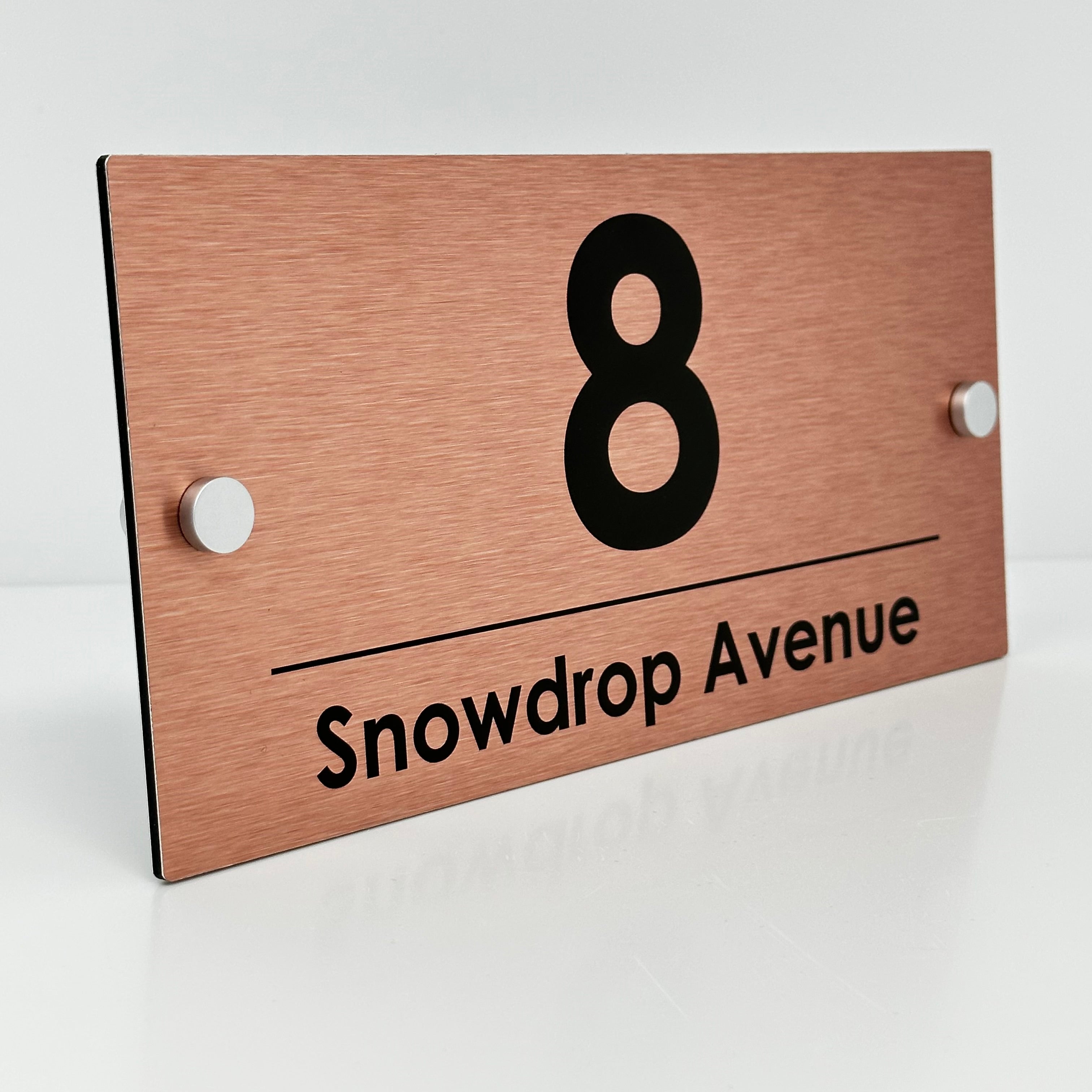 The Snowdrop Modern House Sign with a Brushed Copper Panel and Satin Silver Stand Off Fixings ( Size - 25cm x 12cm )