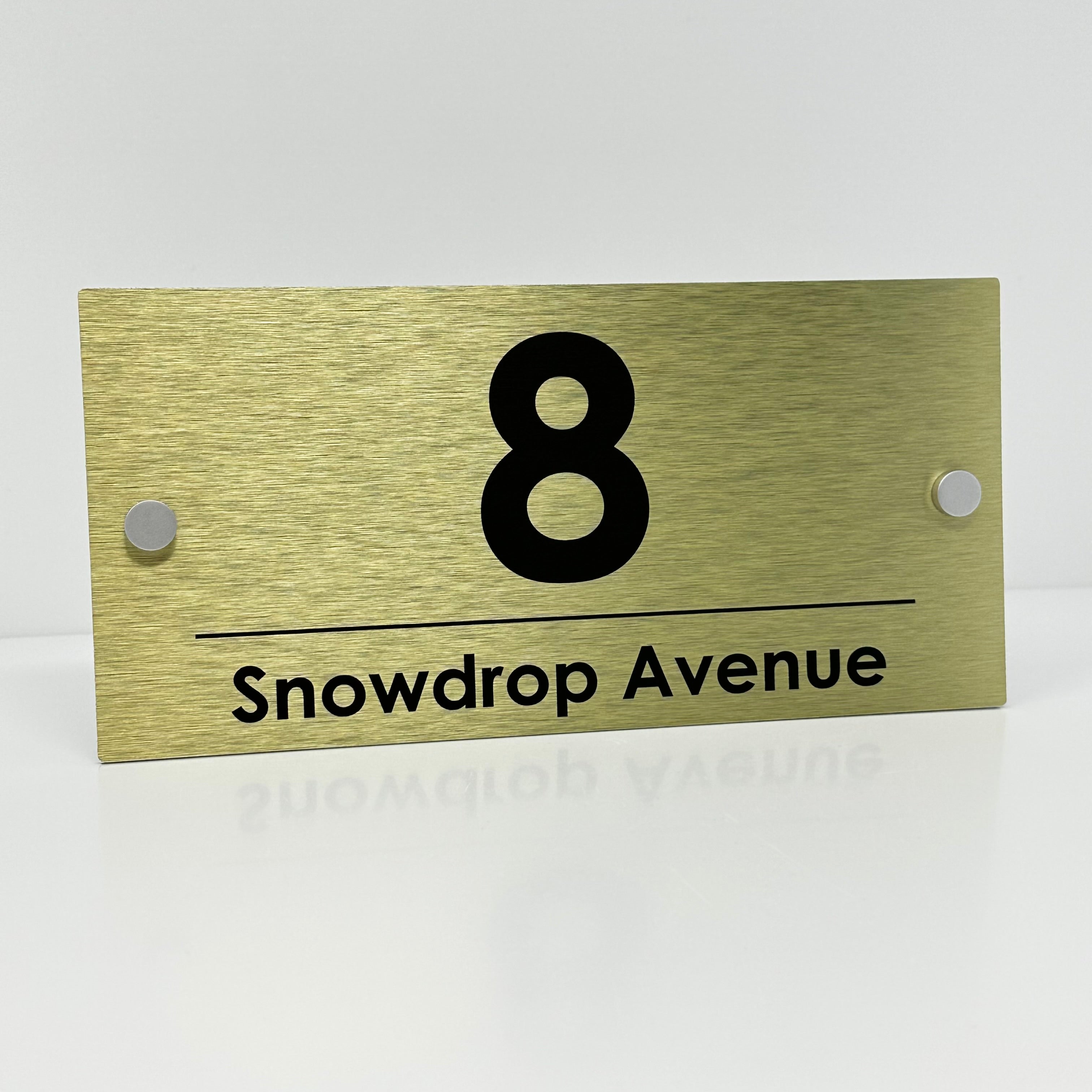 The Snowdrop Modern House Sign with a Brushed Gold Panel and Satin Silver Stand Off Fixings ( Size - 25cm x 12cm )